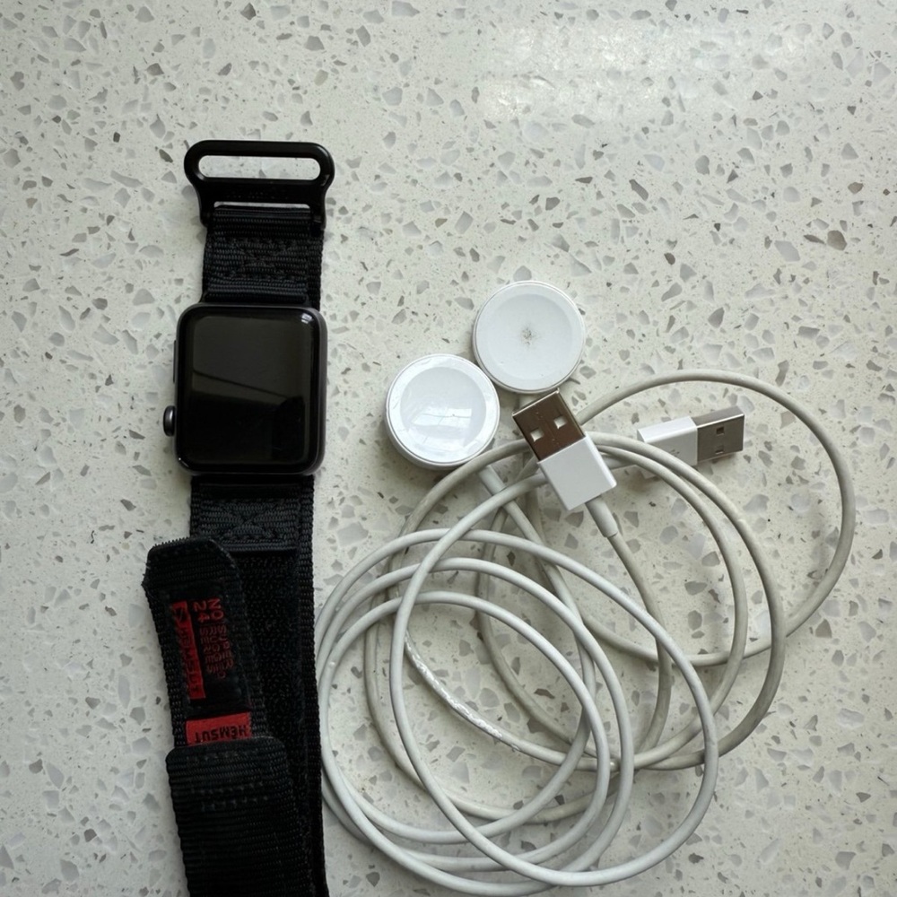 Apple Watch with Black Band and White Charger